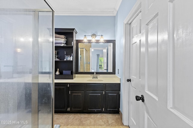 full bathroom with ornamental molding, a stall shower, and vanity