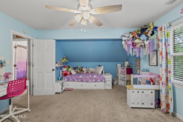bedroom with carpet and a ceiling fan