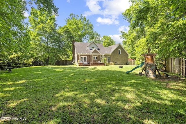 view of front of property with a playground