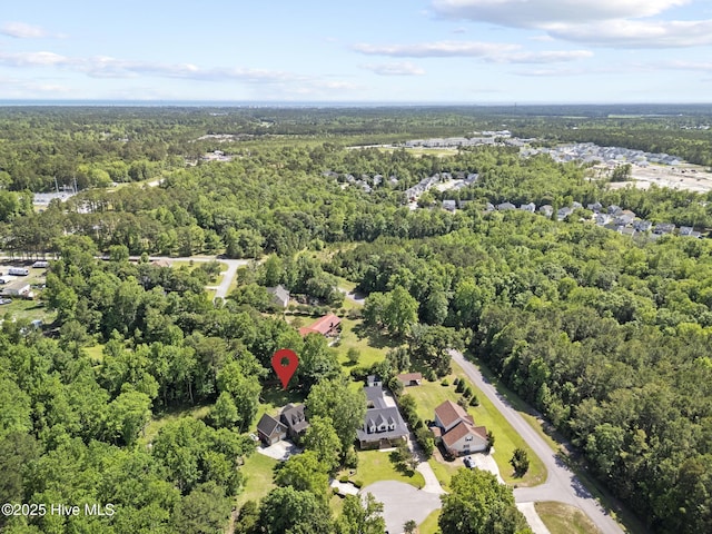 aerial overview of property's location featuring a forest