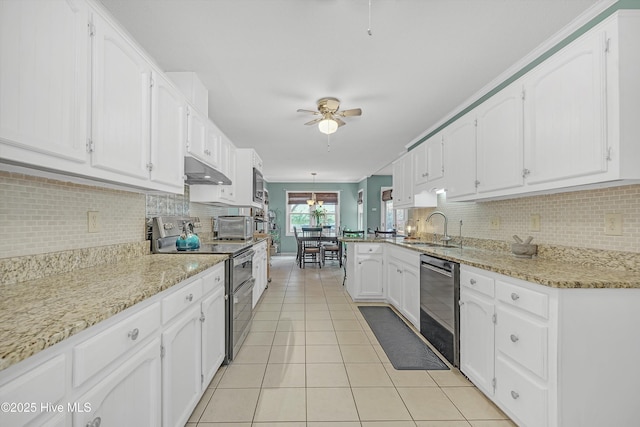 4713 Crosswinds Dr, Wilmington, NC 28409 - kitchen featuring stainless steel appliances, a sink, under cabinet range hood, ceiling fan, and light tile patterned floors