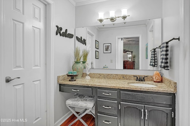 4713 Crosswinds Dr, Wilmington, NC 28409 - bathroom featuring ornamental molding, vanity, wood finished floors, and baseboards
