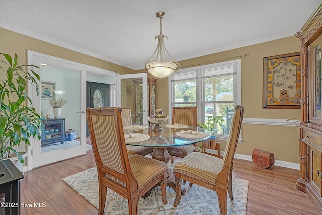 4713 Crosswinds Dr, Wilmington, NC 28409 - dining area with wood finished floors, ornamental molding, and baseboards