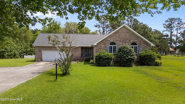 9333 Doris Dr, Oriental, NC 28571 - ranch-style home featuring brick siding, an attached garage, concrete driveway, and a front lawn