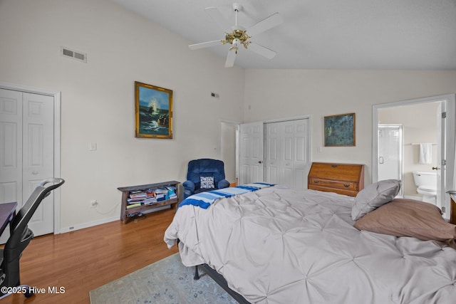 9333 Doris Dr, Oriental, NC 28571 - bedroom featuring high vaulted ceiling, wood finished floors, baseboards, a closet, and ensuite bathroom