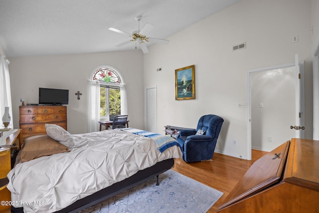 9333 Doris Dr, Oriental, NC 28571 - bedroom with wood finished floors, baseboards, high vaulted ceiling, and ceiling fan
