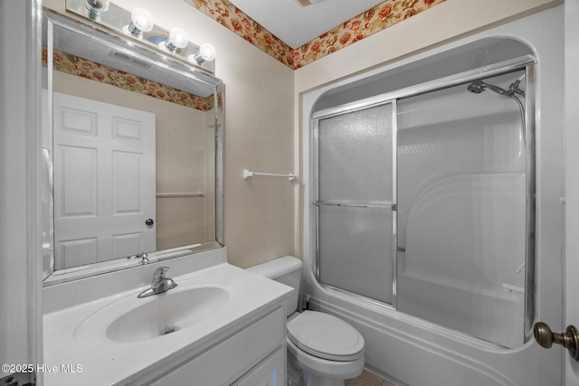 9333 Doris Dr, Oriental, NC 28571 - full bathroom featuring toilet, vanity, enclosed tub / shower combo, and a textured ceiling