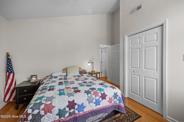 9333 Doris Dr, Oriental, NC 28571 - bedroom featuring wood finished floors, a closet, a ceiling fan, and baseboards