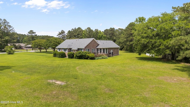 9333 Doris Dr, Oriental, NC 28571 - view of front of property with a front yard and a wooden deck