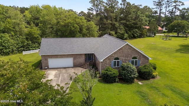 9333 Doris Dr, Oriental, NC 28571 - view of front of home featuring brick siding, a front lawn, driveway, and a garage
