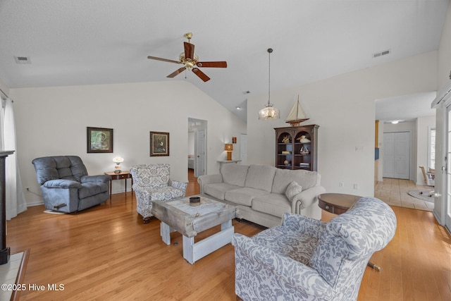 9333 Doris Dr, Oriental, NC 28571 - living room with vaulted ceiling, a ceiling fan, and light wood-style flooring