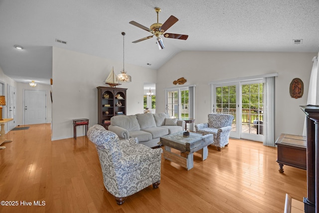 9333 Doris Dr, Oriental, NC 28571 - living area featuring a ceiling fan, light wood-style flooring, high vaulted ceiling, and a textured ceiling