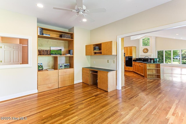 20 Shenecossett Ln, Pinehurst, NC 28374 - kitchen featuring open shelves, light wood-type flooring, a sink, a ceiling fan, and lofted ceiling