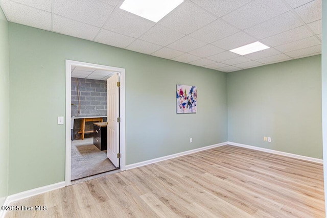 20 Shenecossett Ln, Pinehurst, NC 28374 - spare room with wood finished floors, baseboards, a drop ceiling, and a fireplace