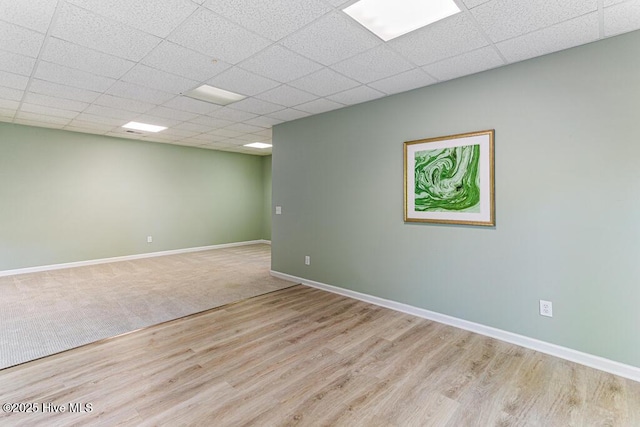 20 Shenecossett Ln, Pinehurst, NC 28374 - unfurnished room with wood finished floors, baseboards, and a drop ceiling