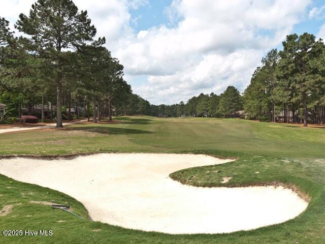 20 Shenecossett Ln, Pinehurst, NC 28374 - view of home's community featuring golf course view, a yard, and view of wooded area