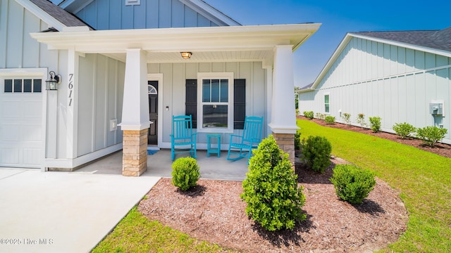 doorway to property featuring board and batten siding, a porch, roof with shingles, an attached garage, and a lawn