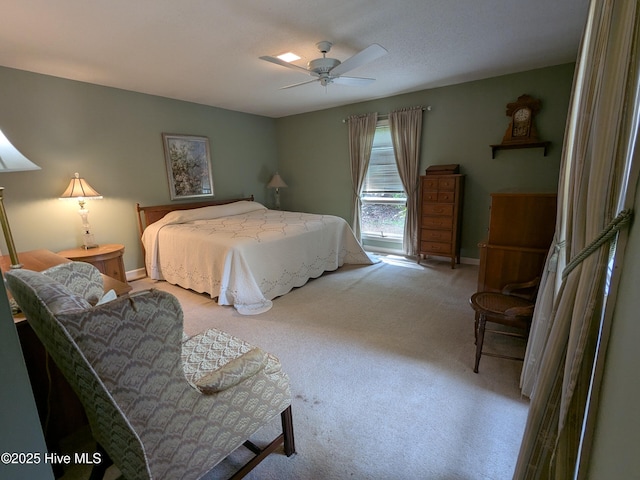 carpeted bedroom with baseboards and ceiling fan