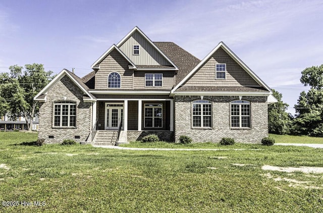 131 Putters Ln, Pinetops, NC 27864 - view of front of house with a front yard, roof with shingles, and board and batten siding