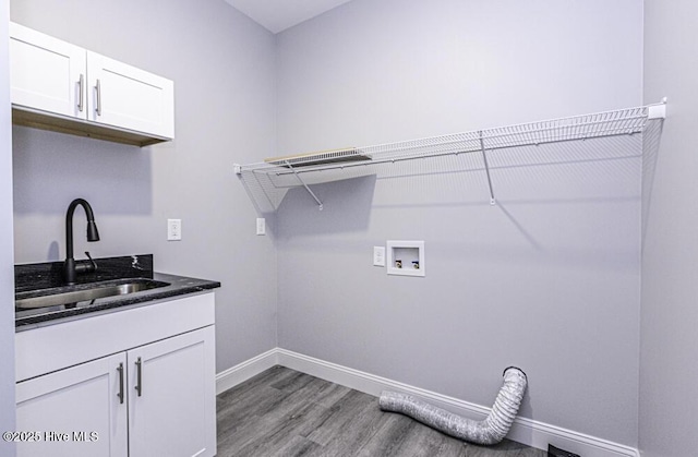 131 Putters Ln, Pinetops, NC 27864 - laundry area featuring wood finished floors, baseboards, cabinet space, and washer hookup