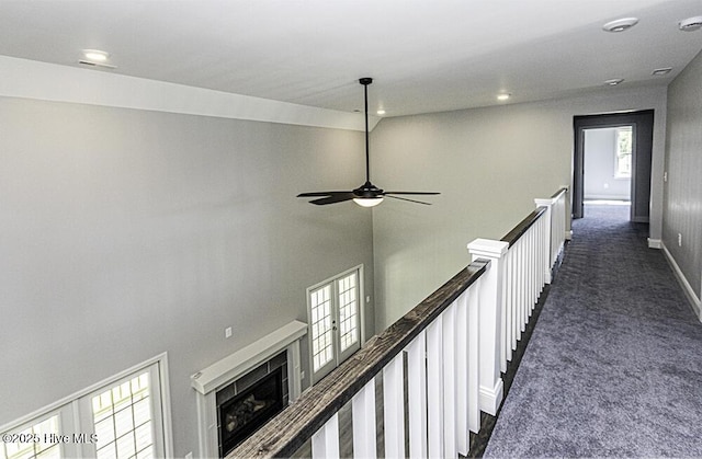 131 Putters Ln, Pinetops, NC 27864 - corridor featuring dark carpet, baseboards, an upstairs landing, and recessed lighting