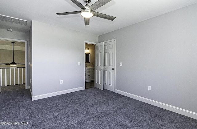 131 Putters Ln, Pinetops, NC 27864 - unfurnished bedroom featuring dark colored carpet, baseboards, and ceiling fan