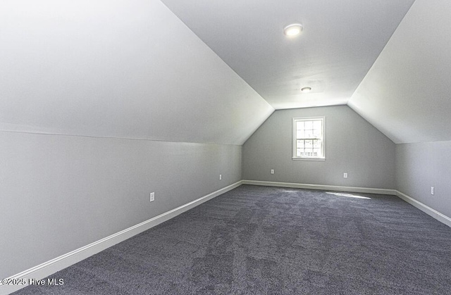 131 Putters Ln, Pinetops, NC 27864 - additional living space featuring vaulted ceiling, baseboards, and dark colored carpet
