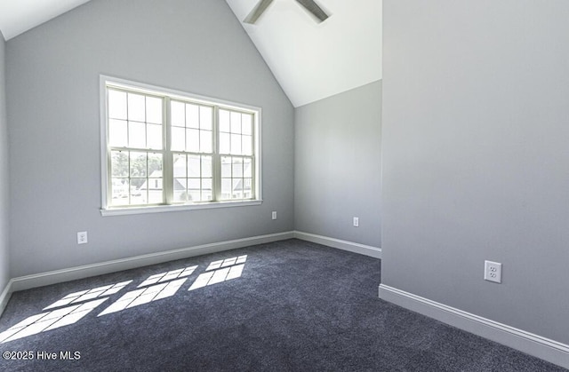 131 Putters Ln, Pinetops, NC 27864 - empty room featuring dark carpet, lofted ceiling, and baseboards