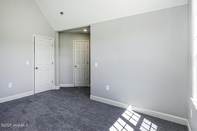131 Putters Ln, Pinetops, NC 27864 - unfurnished room with dark carpet, baseboards, and high vaulted ceiling