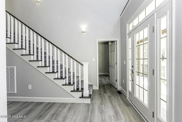131 Putters Ln, Pinetops, NC 27864 - entrance foyer with wood finished floors, baseboards, stairs, and a high ceiling