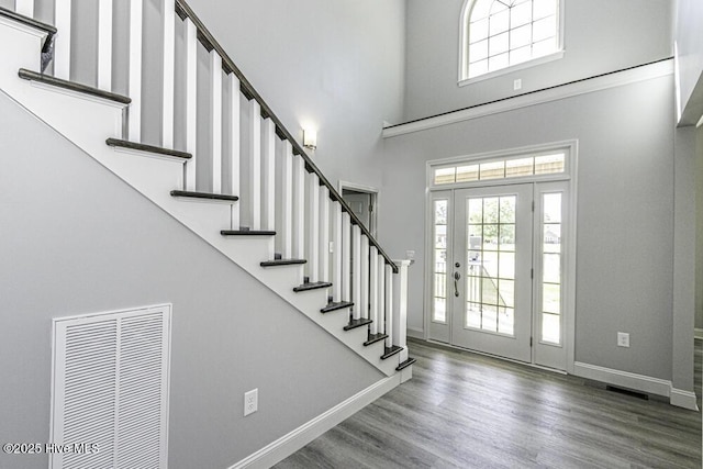 131 Putters Ln, Pinetops, NC 27864 - entrance foyer featuring baseboards, stairway, a high ceiling, and wood finished floors