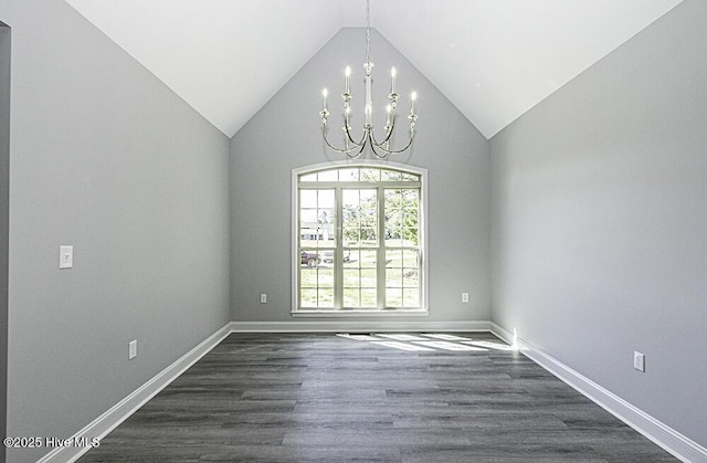 131 Putters Ln, Pinetops, NC 27864 - empty room with a chandelier, dark wood-style floors, vaulted ceiling, and baseboards