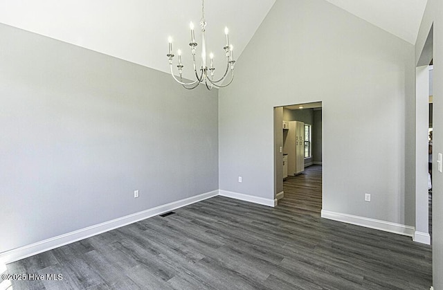131 Putters Ln, Pinetops, NC 27864 - unfurnished room featuring a chandelier, dark wood-style floors, baseboards, and high vaulted ceiling