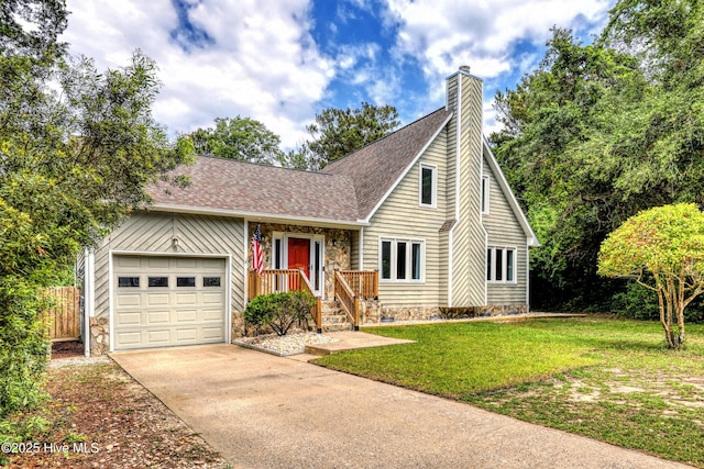 107 Live Oak Ct, Pine Knoll Shores, NC 28512 - view of front of property featuring a garage, driveway, a chimney, roof with shingles, and stone siding