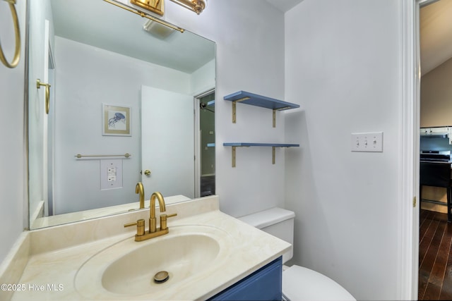 107 Live Oak Ct, Pine Knoll Shores, NC 28512 - bathroom featuring toilet, vanity, and wood finished floors
