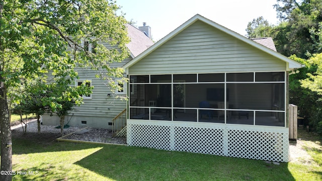 107 Live Oak Ct, Pine Knoll Shores, NC 28512 - back of property featuring a sunroom, crawl space, a yard, and a chimney