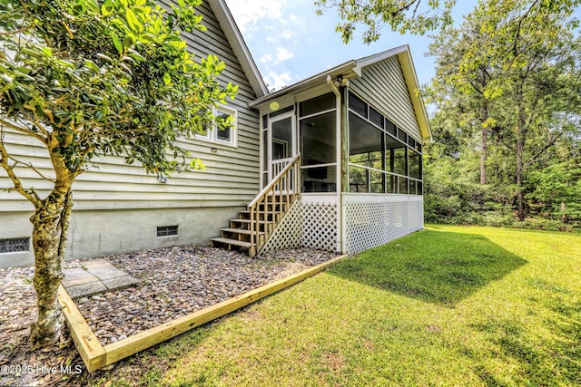 107 Live Oak Ct, Pine Knoll Shores, NC 28512 - rear view of property featuring a sunroom, crawl space, and a lawn