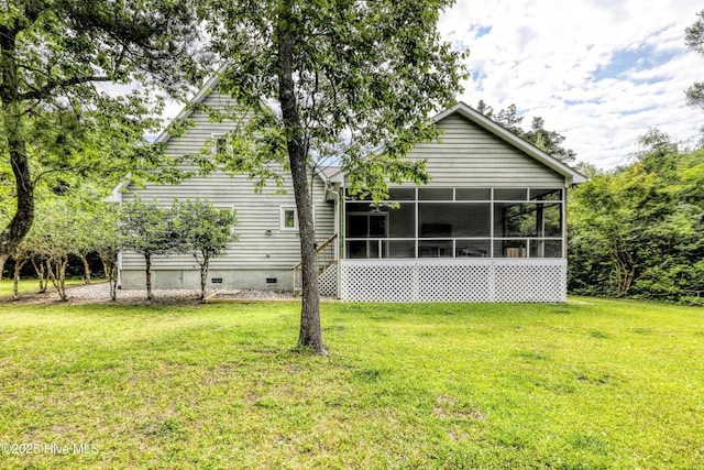 107 Live Oak Ct, Pine Knoll Shores, NC 28512 - back of property with crawl space, a sunroom, and a lawn