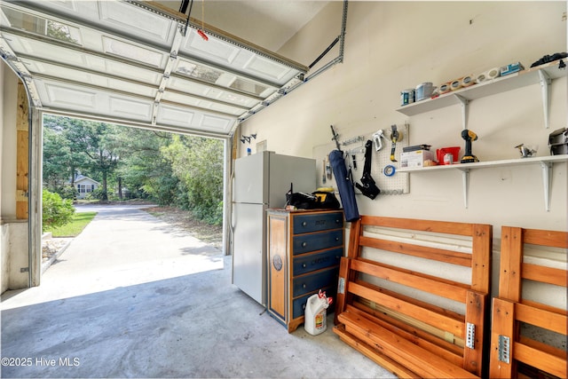 107 Live Oak Ct, Pine Knoll Shores, NC 28512 - garage featuring freestanding refrigerator