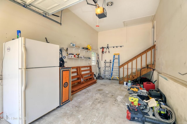 107 Live Oak Ct, Pine Knoll Shores, NC 28512 - garage with freestanding refrigerator and a garage door opener