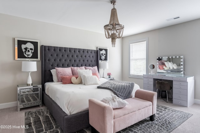 bedroom with carpet floors and baseboards