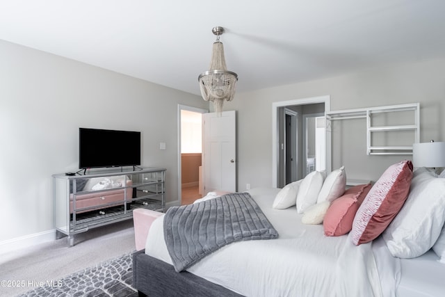 bedroom with carpet flooring and baseboards