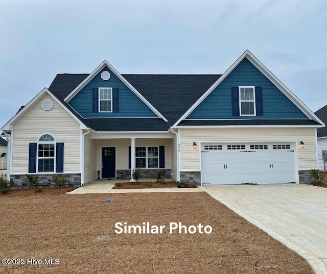 754 Secession Ln, Jacksonville, NC 28546 - craftsman-style house featuring stone siding, driveway, and a porch