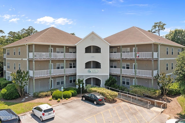 view of property with uncovered parking