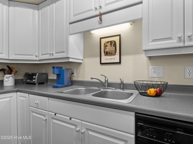 kitchen with dishwasher, a sink, and white cabinets