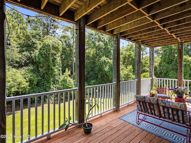 wooden deck with a yard