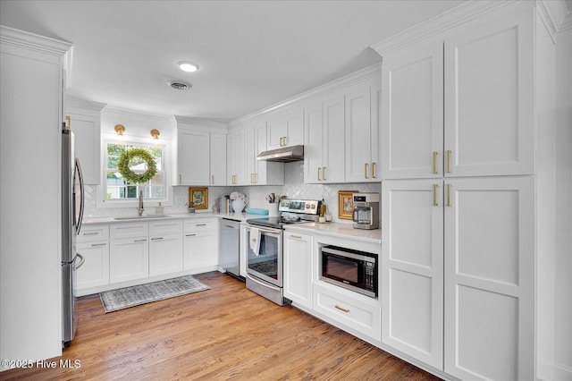125 Windemere Rd, Wilmington, NC 28405 - kitchen featuring stainless steel appliances, under cabinet range hood, and white cabinets