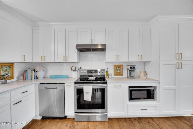 125 Windemere Rd, Wilmington, NC 28405 - kitchen featuring stainless steel appliances, under cabinet range hood, white cabinetry, and light countertops