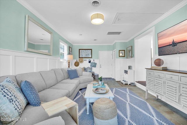 125 Windemere Rd, Wilmington, NC 28405 - living area with a decorative wall, crown molding, wainscoting, and attic access