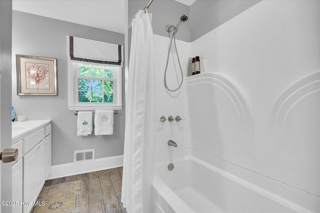 125 Windemere Rd, Wilmington, NC 28405 - full bathroom featuring shower / bathtub combination with curtain, vanity, and wood finished floors